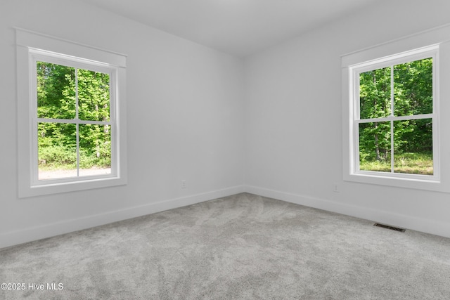 140 E Ag Dr, New Bern, NC 28562 - unfurnished room with healthy amount of natural light, baseboards, and carpet