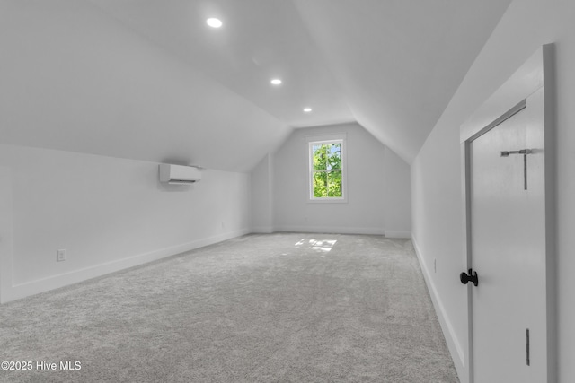140 E Ag Dr, New Bern, NC 28562 - bonus room featuring a wall mounted AC, vaulted ceiling, carpet flooring, recessed lighting, and baseboards