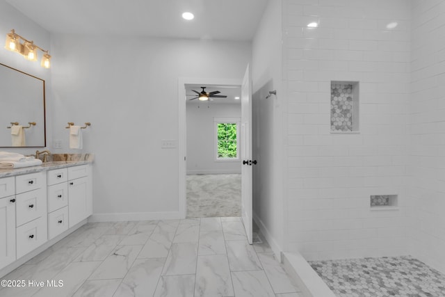 140 E Ag Dr, New Bern, NC 28562 - bathroom with a ceiling fan, marble finish flooring, double vanity, baseboards, and tiled shower