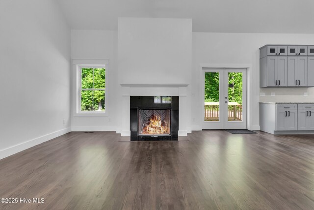 140 E Ag Dr, New Bern, NC 28562 - unfurnished living room featuring wood finished floors, a fireplace, and baseboards