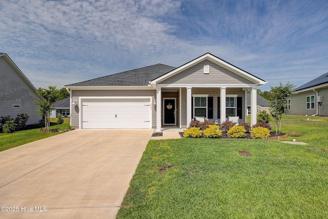 6909 English Holly Ct SW, Ocean Isle Beach, NC 28469 - view of front of home featuring an attached garage, driveway, a front yard, and covered porch