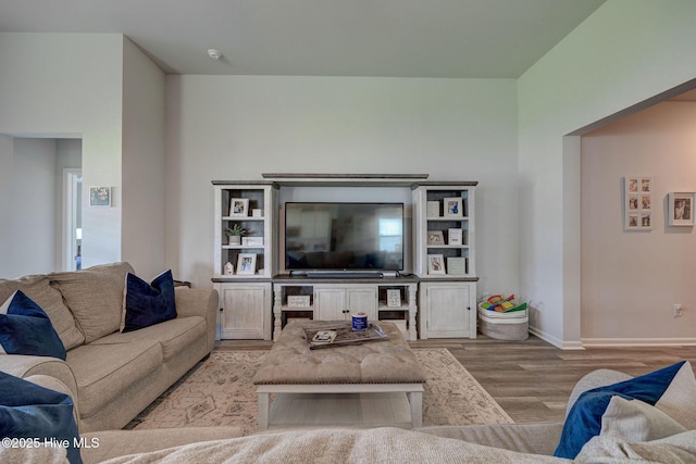 6909 English Holly Ct SW, Ocean Isle Beach, NC 28469 - living room featuring wood finished floors and baseboards