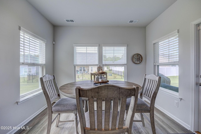 6909 English Holly Ct SW, Ocean Isle Beach, NC 28469 - dining space with wood finished floors and baseboards