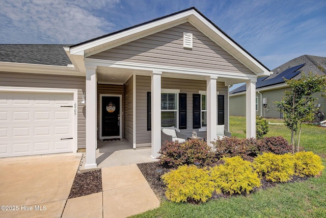6909 English Holly Ct SW, Ocean Isle Beach, NC 28469 - view of front of house with a porch and a garage