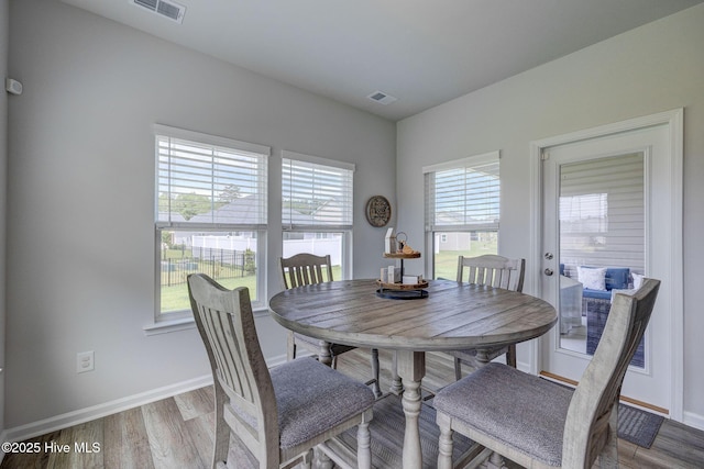 6909 English Holly Ct SW, Ocean Isle Beach, NC 28469 - dining space with baseboards and wood finished floors
