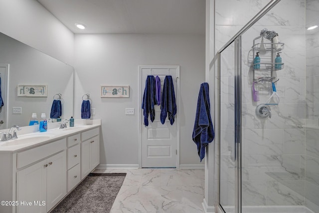 6909 English Holly Ct SW, Ocean Isle Beach, NC 28469 - bathroom with marble look tile flooring, a stall shower, double vanity, and baseboards