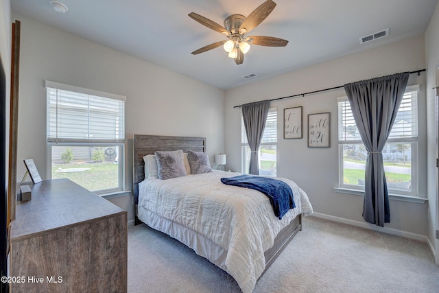 6909 English Holly Ct SW, Ocean Isle Beach, NC 28469 - bedroom with carpet floors, baseboards, and a ceiling fan