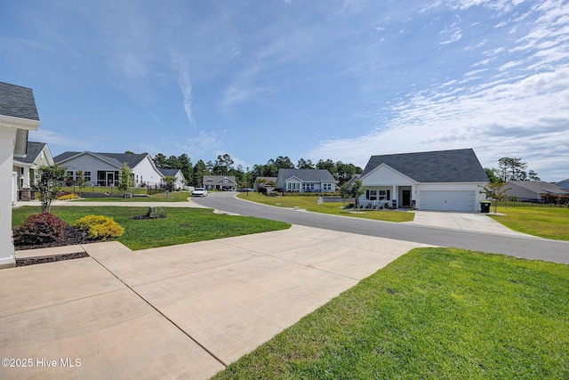 6909 English Holly Ct SW, Ocean Isle Beach, NC 28469 - view of concrete driveway featuring a residential view