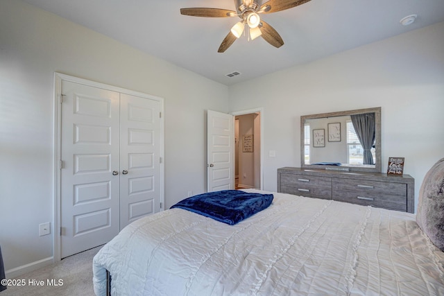 6909 English Holly Ct SW, Ocean Isle Beach, NC 28469 - bedroom featuring carpet, a closet, ceiling fan, and baseboards