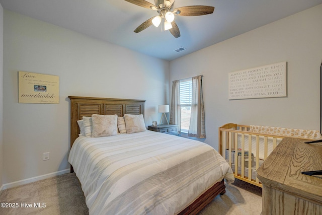 6909 English Holly Ct SW, Ocean Isle Beach, NC 28469 - bedroom featuring light colored carpet, baseboards, and a ceiling fan