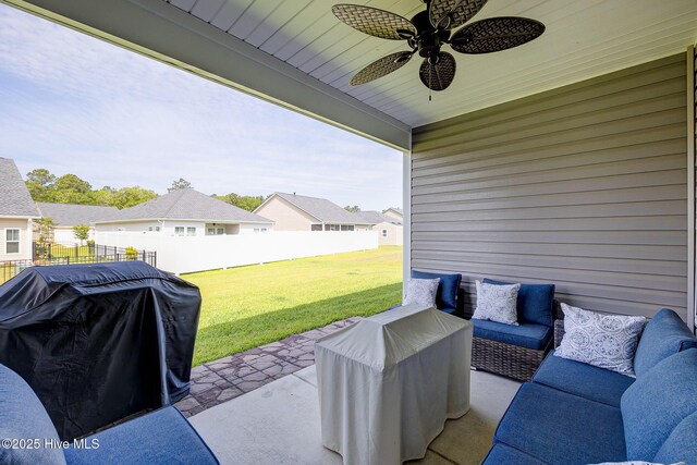 6909 English Holly Ct SW, Ocean Isle Beach, NC 28469 - view of patio featuring a ceiling fan, an outdoor living space, a residential view, and a grill