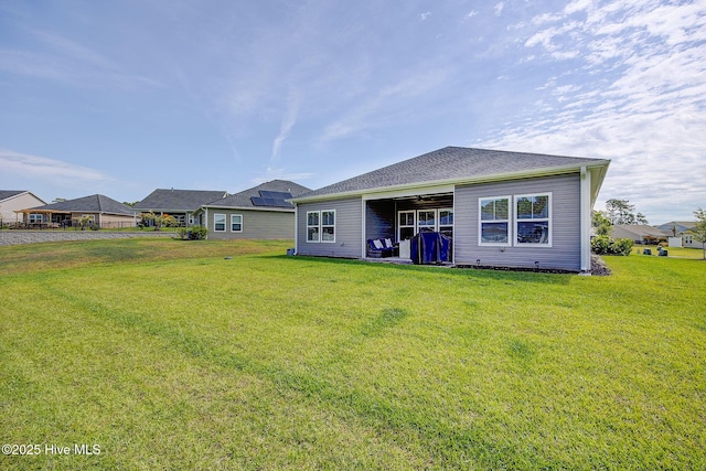 6909 English Holly Ct SW, Ocean Isle Beach, NC 28469 - back of house with a lawn