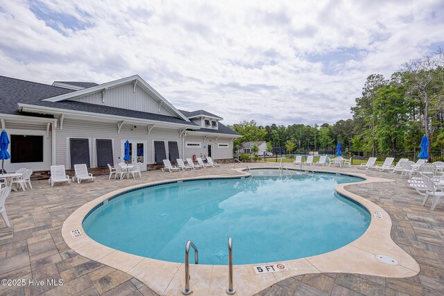 6909 English Holly Ct SW, Ocean Isle Beach, NC 28469 - community pool featuring a patio and fence