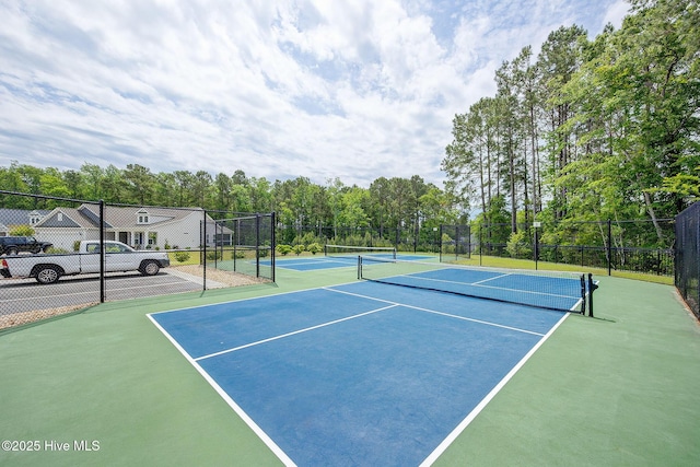 6909 English Holly Ct SW, Ocean Isle Beach, NC 28469 - view of tennis court with fence and community basketball court