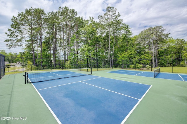 6909 English Holly Ct SW, Ocean Isle Beach, NC 28469 - view of tennis court with community basketball court and fence