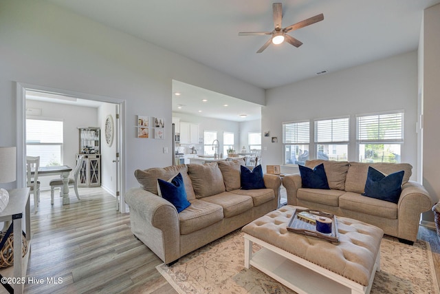 6909 English Holly Ct SW, Ocean Isle Beach, NC 28469 - living area with light wood-style floors, ceiling fan, plenty of natural light, recessed lighting, and baseboards