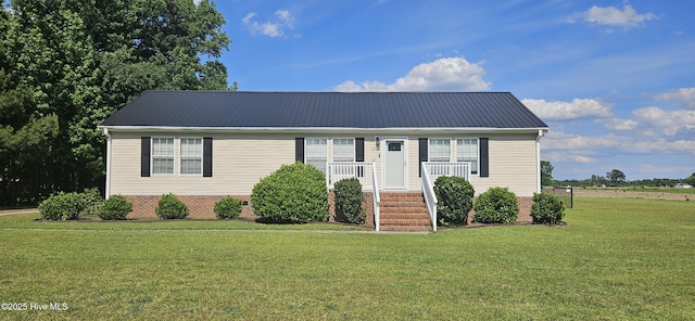 1970 Old Raleigh Rd, Clinton, NC 28328 - view of front facade with a front yard, metal roof, and covered porch