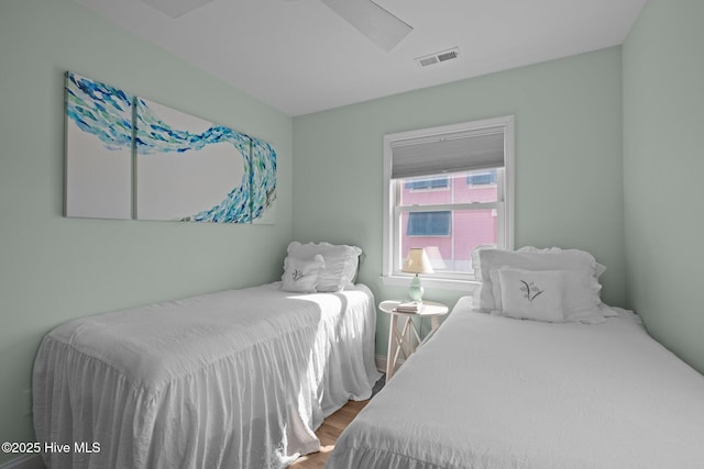 bedroom with wood finished floors