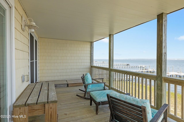 balcony featuring a water view