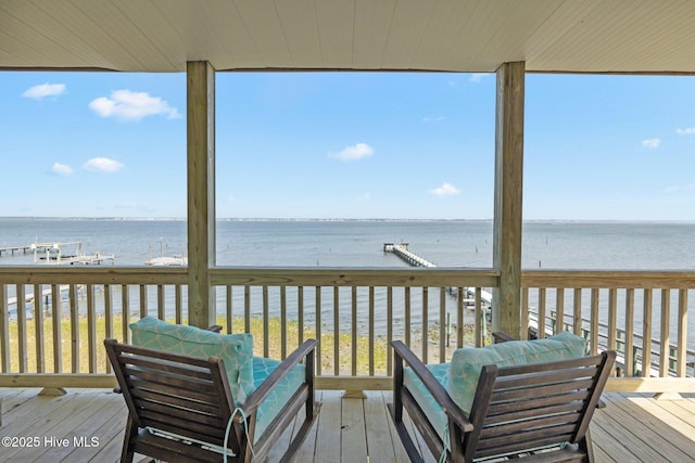 wooden deck with a water view
