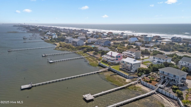 aerial perspective of suburban area featuring a nearby body of water