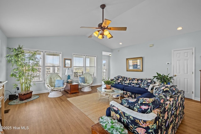 living area with ceiling fan, vaulted ceiling, wood finished floors, baseboards, and recessed lighting