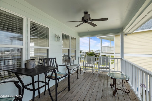 sunroom with a ceiling fan