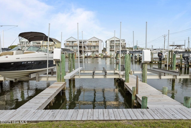 dock with boat lift and a water view