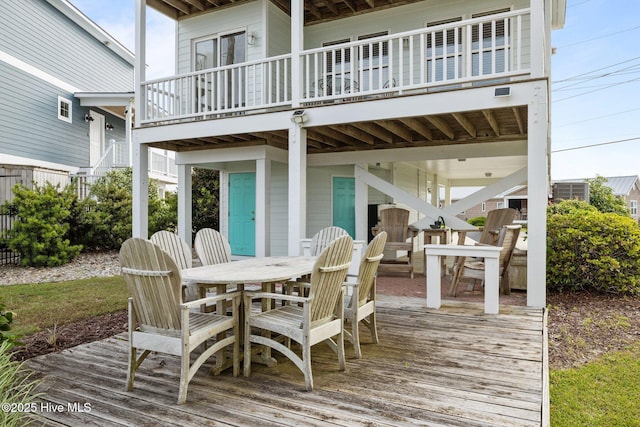deck with outdoor dining area