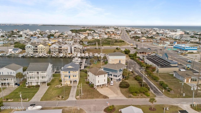 aerial perspective of suburban area featuring a large body of water