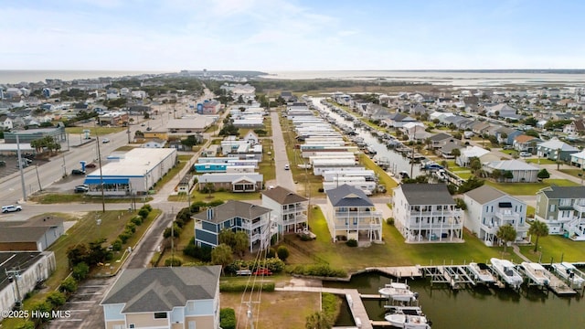 aerial perspective of suburban area featuring a nearby body of water