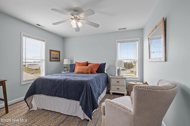 bedroom featuring baseboards and a ceiling fan