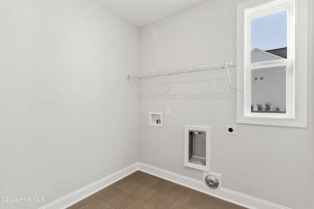 laundry area with electric dryer hookup, baseboards, and hookup for a washing machine