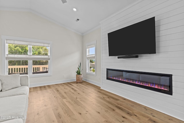 921 Whitecaps Ln, Carolina Beach, NC 28428 - unfurnished living room featuring crown molding, a fireplace, healthy amount of natural light, wood finished floors, and baseboards