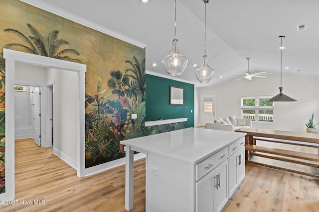 921 Whitecaps Ln, Carolina Beach, NC 28428 - kitchen with recessed lighting, light wood-style flooring, white cabinets, ceiling fan, and a kitchen island