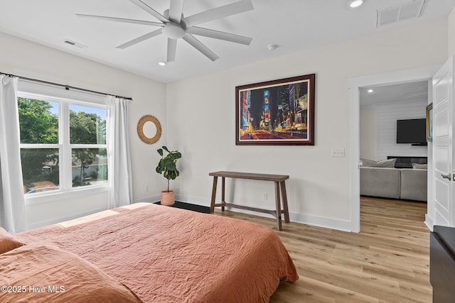 921 Whitecaps Ln, Carolina Beach, NC 28428 - bedroom featuring light wood finished floors, recessed lighting, baseboards, and ceiling fan
