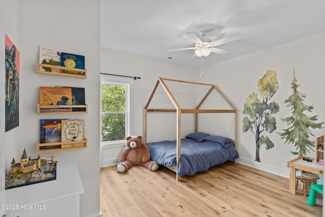 921 Whitecaps Ln, Carolina Beach, NC 28428 - bedroom featuring wood finished floors, baseboards, and a ceiling fan