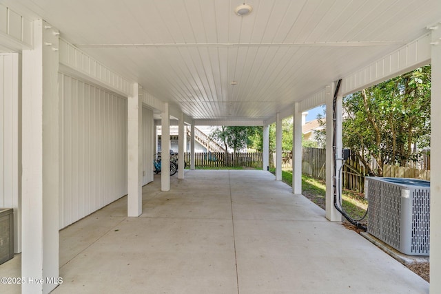 921 Whitecaps Ln, Carolina Beach, NC 28428 - view of patio featuring central air condition unit and a carport