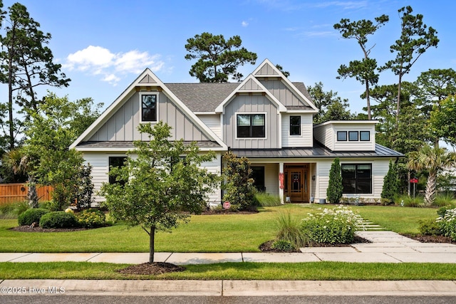3528 Cordgrass Ln, Wilmington, NC 28409 - view of front of house with board and batten siding, a standing seam roof, metal roof, and covered porch