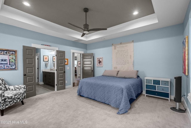 3528 Cordgrass Ln, Wilmington, NC 28409 - carpeted bedroom with recessed lighting, a raised ceiling, baseboards, connected bathroom, and ceiling fan