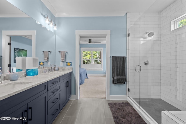 3528 Cordgrass Ln, Wilmington, NC 28409 - full bathroom with ensuite bathroom, double vanity, a stall shower, a ceiling fan, and baseboards