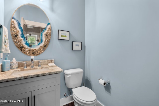 3528 Cordgrass Ln, Wilmington, NC 28409 - bathroom featuring toilet, vanity, and baseboards