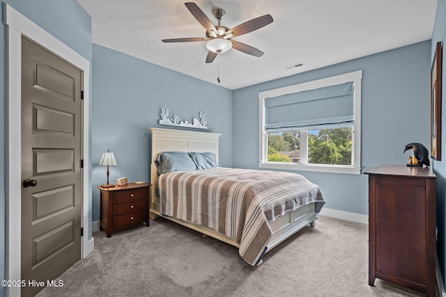 3528 Cordgrass Ln, Wilmington, NC 28409 - carpeted bedroom featuring baseboards and a ceiling fan