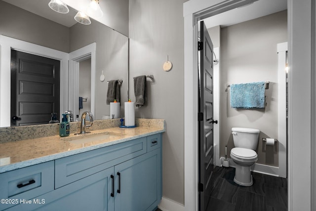 3528 Cordgrass Ln, Wilmington, NC 28409 - bathroom featuring baseboards, vanity, and toilet