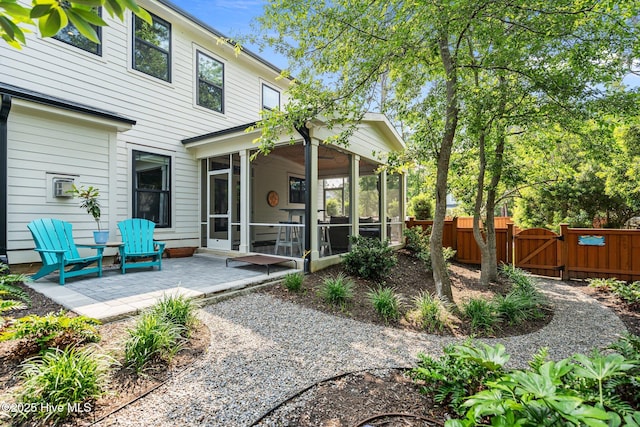 3528 Cordgrass Ln, Wilmington, NC 28409 - back of house with a sunroom, a gate, and a patio area
