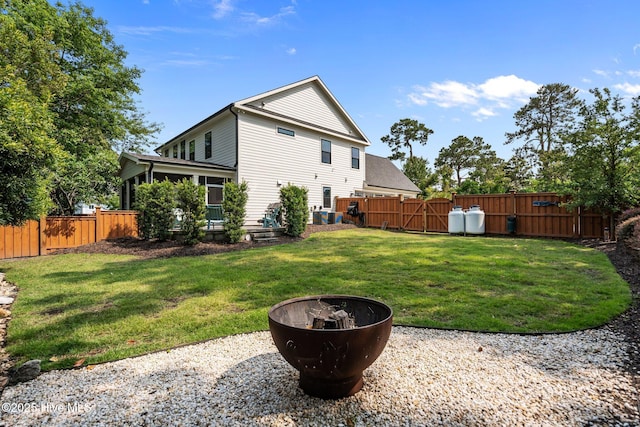 3528 Cordgrass Ln, Wilmington, NC 28409 - rear view of property with an outdoor fire pit