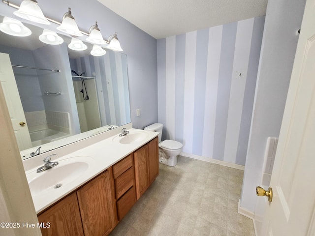 403 Mathew Andrew Ct, Swansboro, NC 28584 - bathroom with wallpapered walls, a shower, toilet, double vanity, and baseboards
