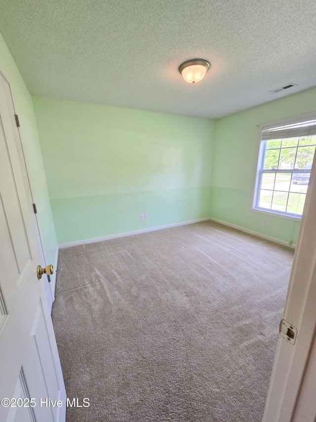 403 Mathew Andrew Ct, Swansboro, NC 28584 - empty room featuring carpet floors, a textured ceiling, and baseboards