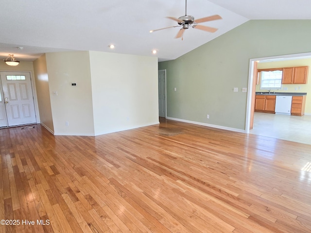 403 Mathew Andrew Ct, Swansboro, NC 28584 - unfurnished living room with a ceiling fan, light wood-style floors, vaulted ceiling, baseboards, and recessed lighting
