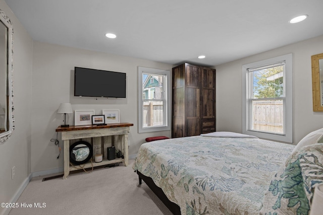 717 Cedar St Unit 1/2, Beaufort, NC 28516 - bedroom featuring multiple windows, carpet, baseboards, and recessed lighting